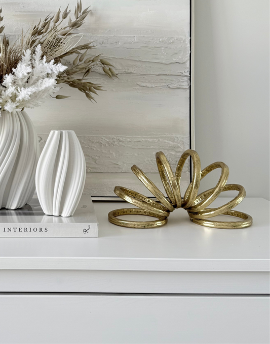 Gold Slinky Sculpture
